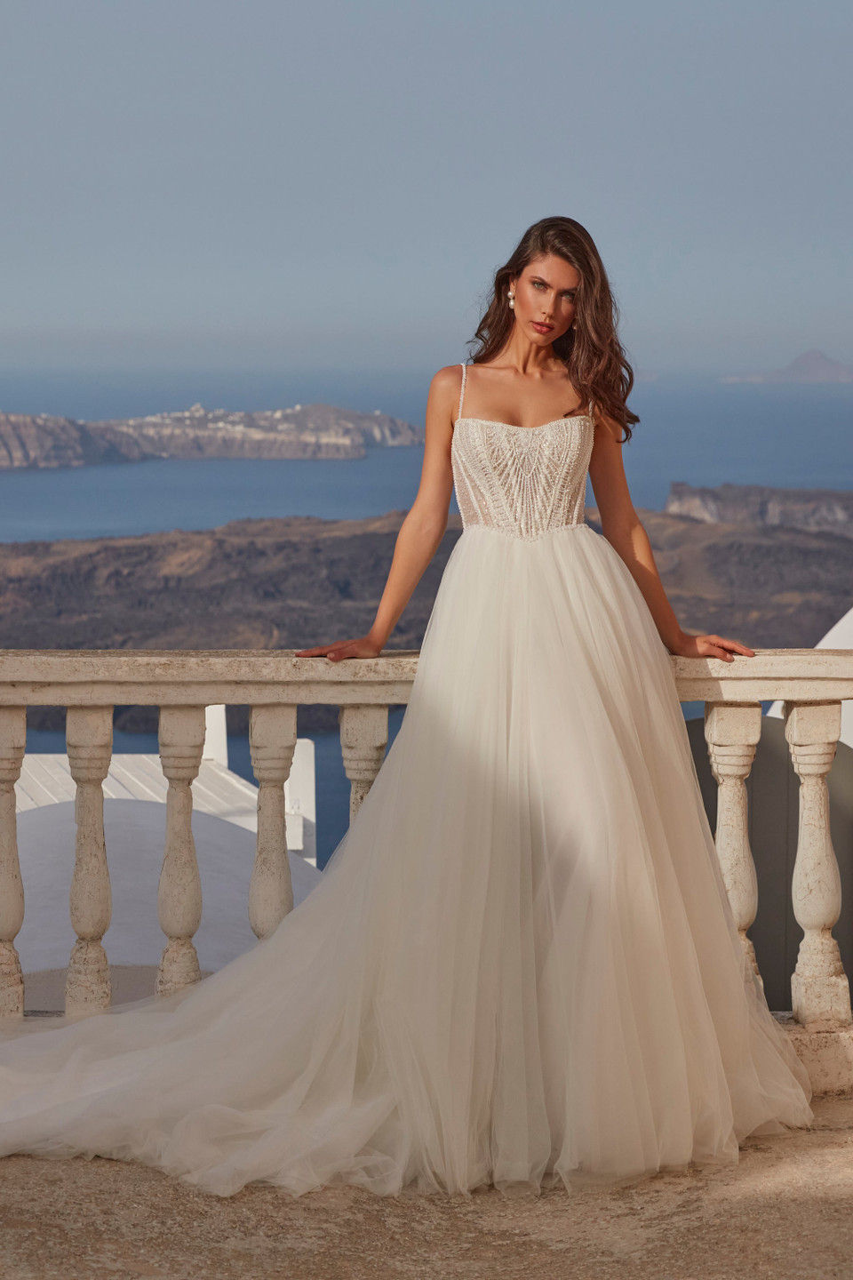 Girl wearing a wedding dress with a beaded bodice and flowy skirt