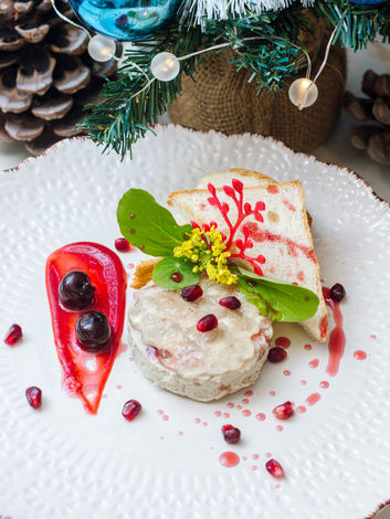 Pate with toast and berries on plate