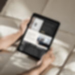 A person holding a tablet viewing Nisi Group Website Design Project Portfolio by Flow Cre8tive Sydney