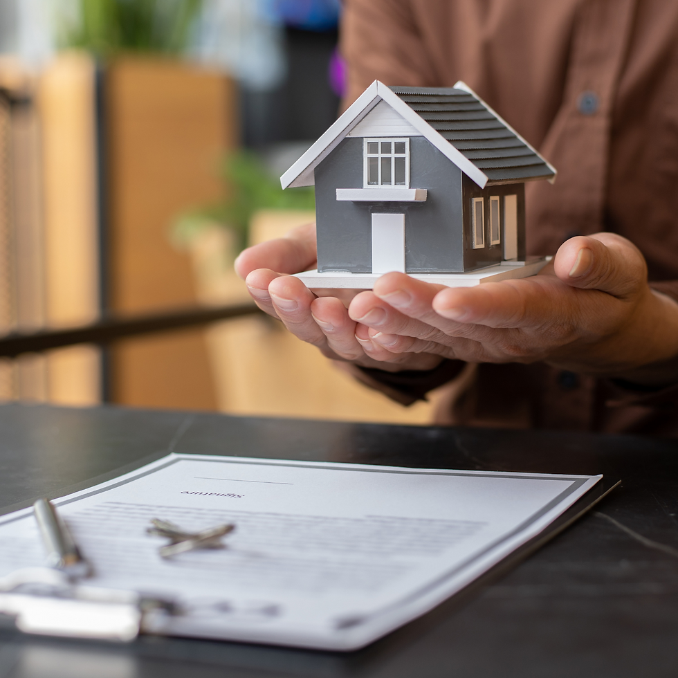 Hands holding house model, contract, keys; Clover Law