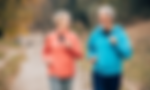 Smiling senior couple jogging outdoors