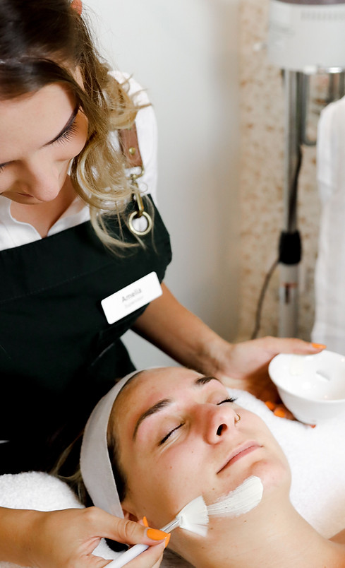 A Woman getting a rejuvenating skin treatment at LUNA Skin and Brow Salon