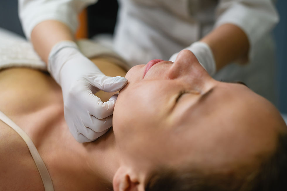 Woman receiving gentle neck and jaw massage