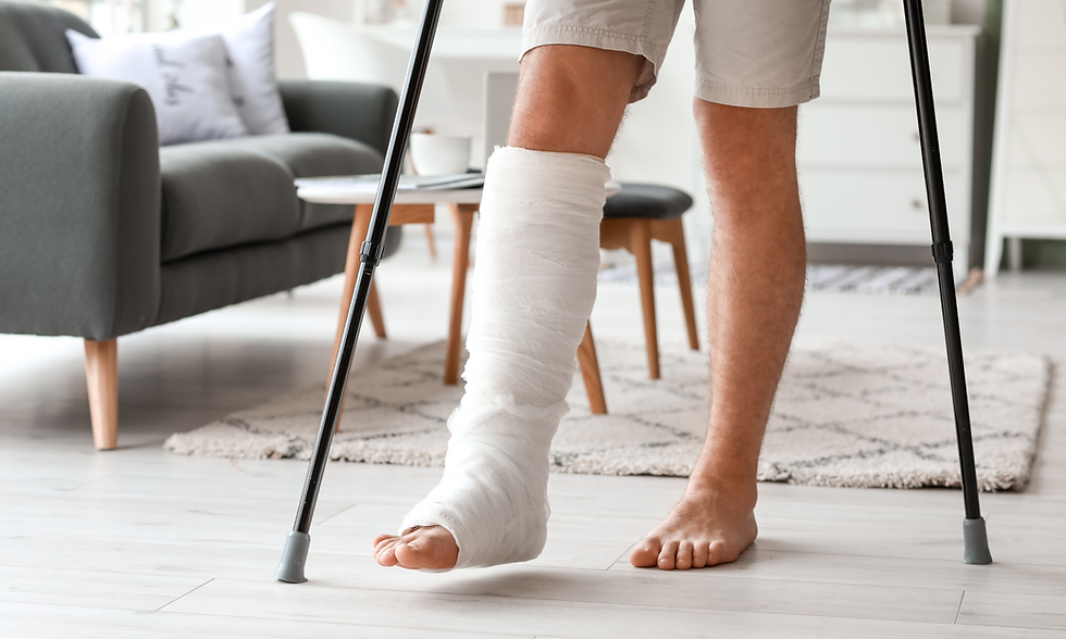 Man with leg cast using crutches at home