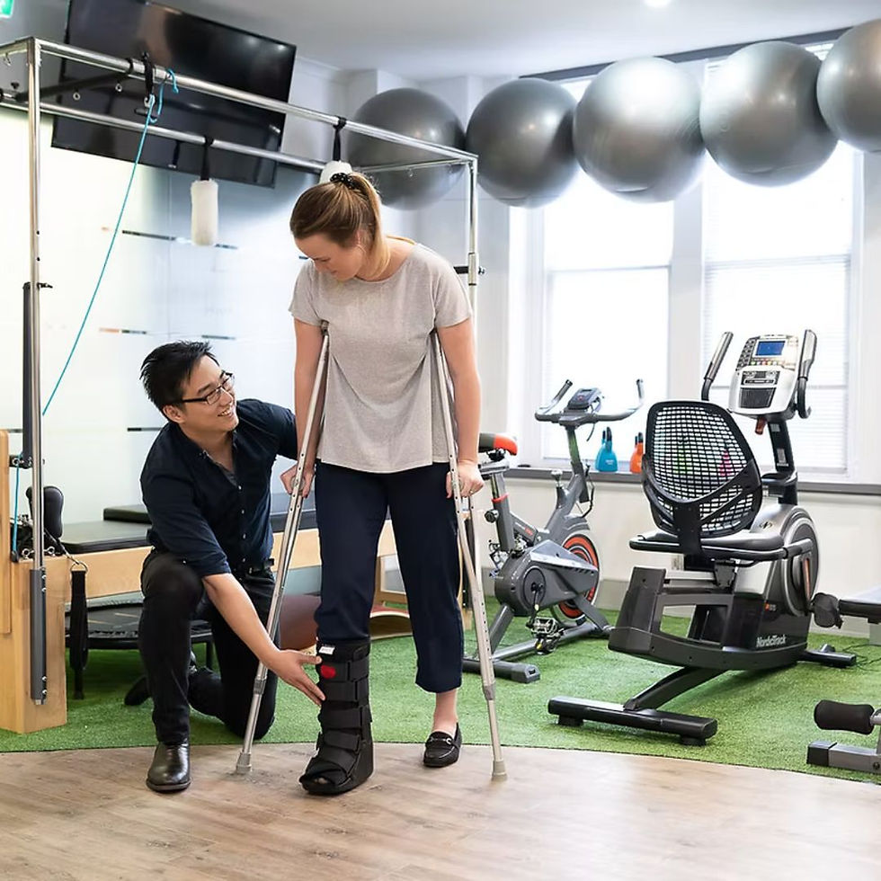 Physiotherapist assisting patient with crutches and leg brace