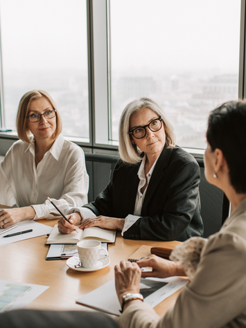 Women in business doing fractional risk management