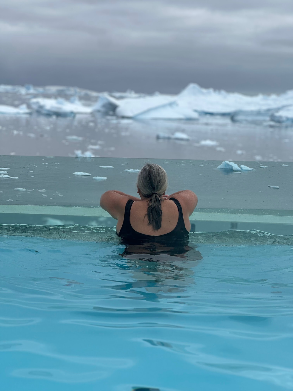 guest in a pool on a swan hellenic ship in antarctica