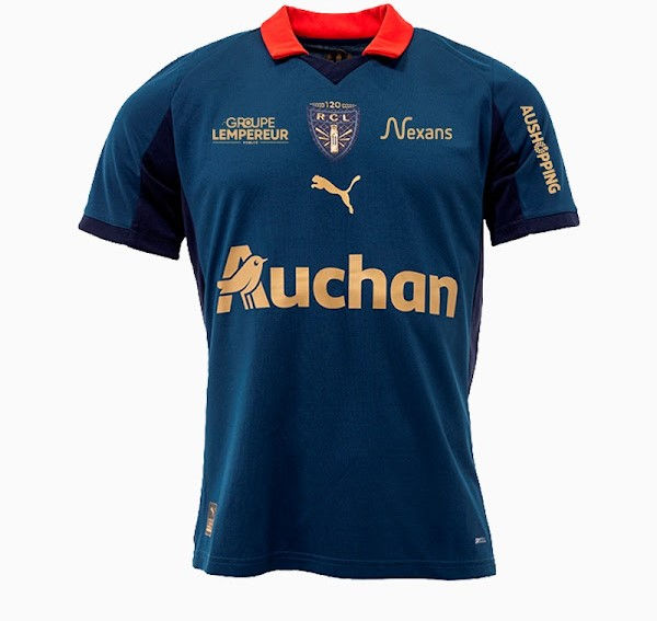 Maillot de football bleu avec col rouge, logos de sponsors dont Auchan en or, et blason du club RCL. Fond blanc.