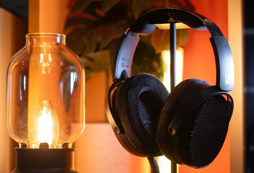 Sennheiser Headphones resting beside a candle