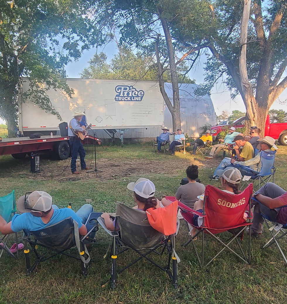people sitting in camp chairs listening to a cowboy poet