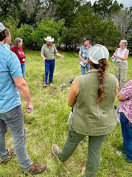 Students and Instructor standing in field