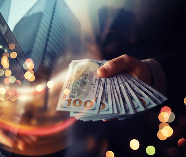 Business Man Displaying a Spread of Cash over a green vintage background.jpg