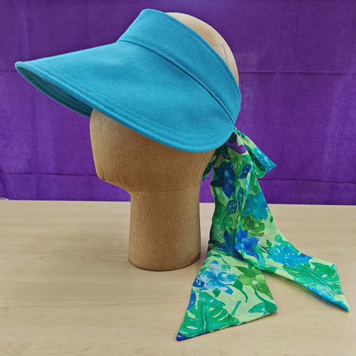 a turquoise-blue visor with a softly tied bow