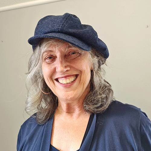 Another happy student wearing her completed navy wool poor boy cap