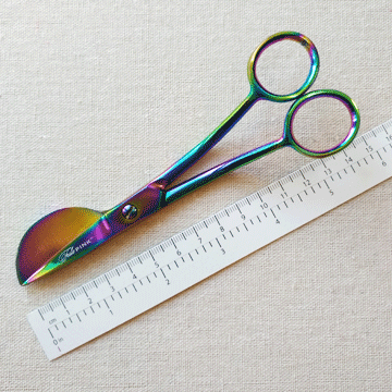 Thumbnail: close-up of Tula Pink 6-inch rainbow finish duckbill scissors with ruler comparison