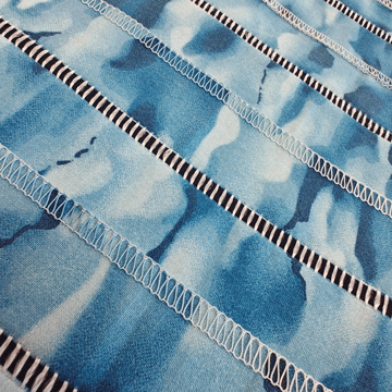blue fabric pieced on serger with decorative effect