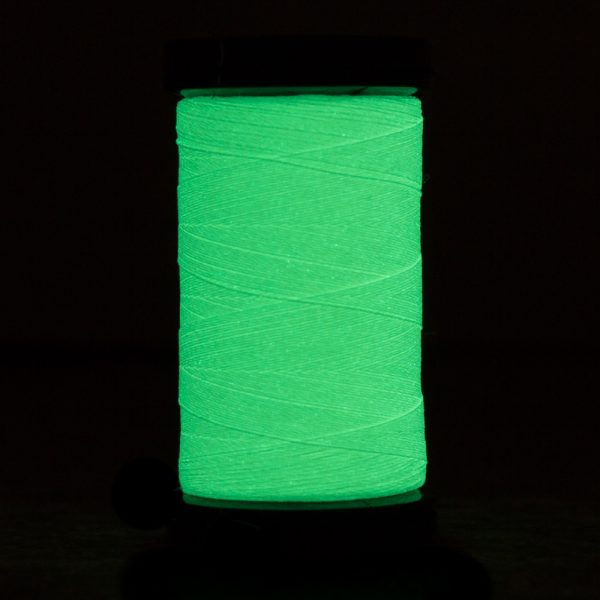 Thumbnail: Wonderfil Brand Ahrora glow-in-the-dark thread cream and pastel yellow glowing