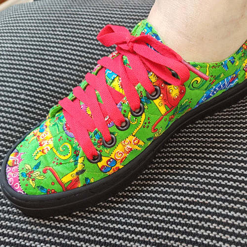 Denise's lime green print sneakers with red laces