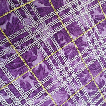 purple fabric stitch-embellished in a plaid pattern