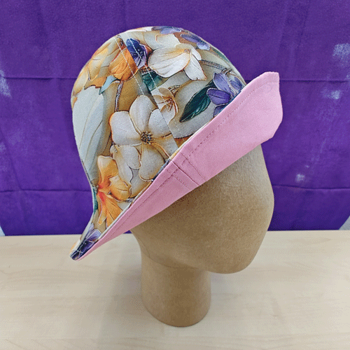 a lovely little floral-print tulip hat with a pink lining