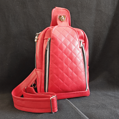 red vinyl speedwell sling bag