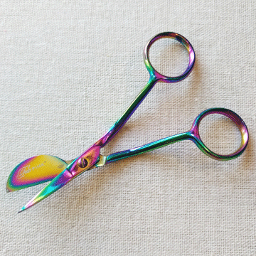 Thumbnail: close-up of Tula Pink 4-inch rainbow finish duckbill scissors, open