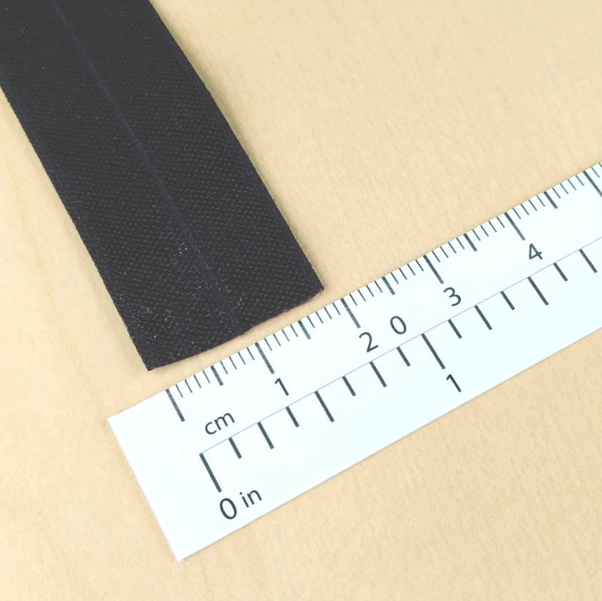 Thumbnail: ½" black foldover elastic shown with ruler for size reference
