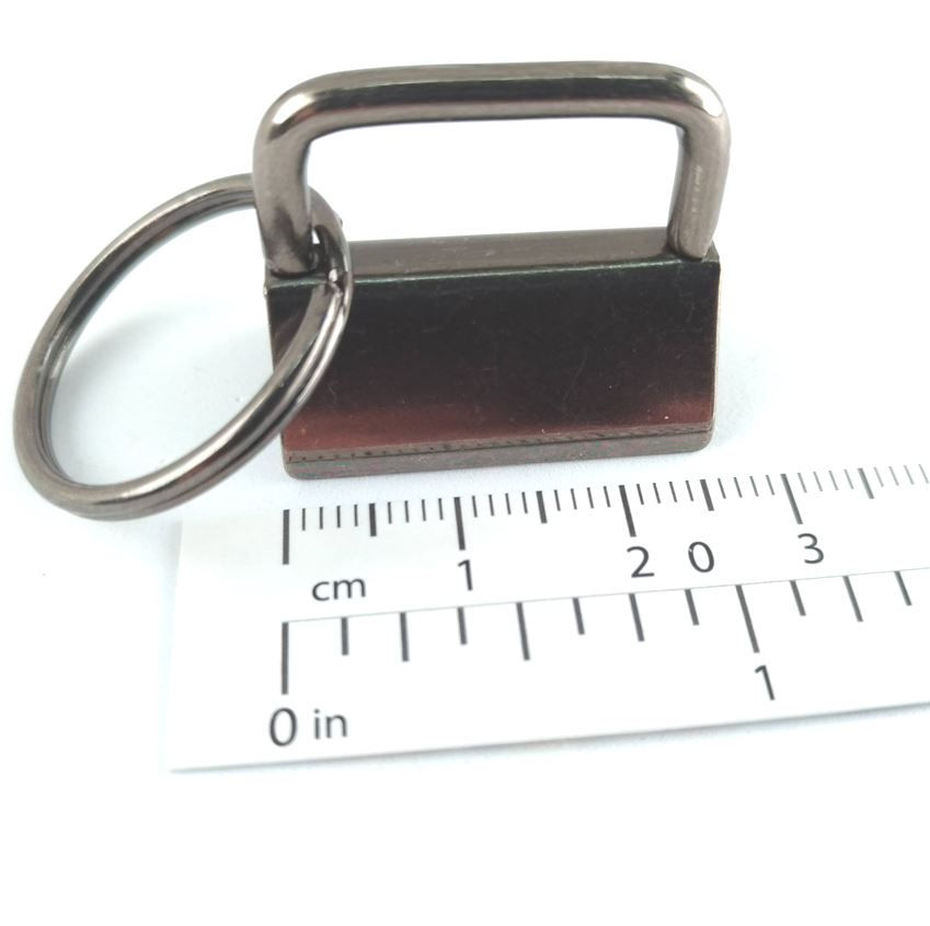 Thumbnail: 1-inch key fob ring and clip hardware in gunmetal with ruler for scale
