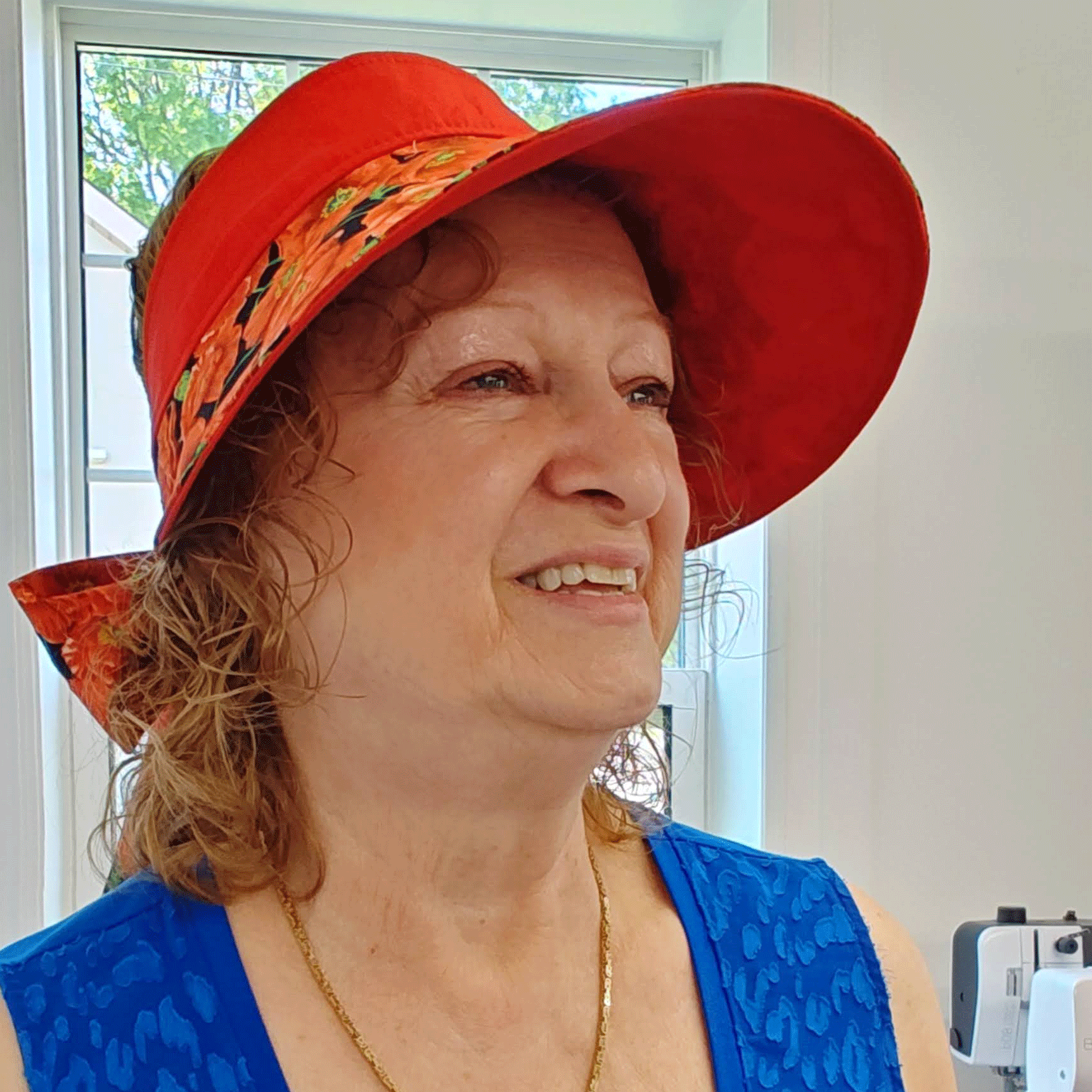 Pat wearing her beautiful new red poppies visor