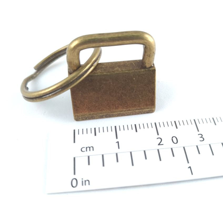Thumbnail: ¾-inch key fob ring and clip hardware in antique brass with ruler for scale