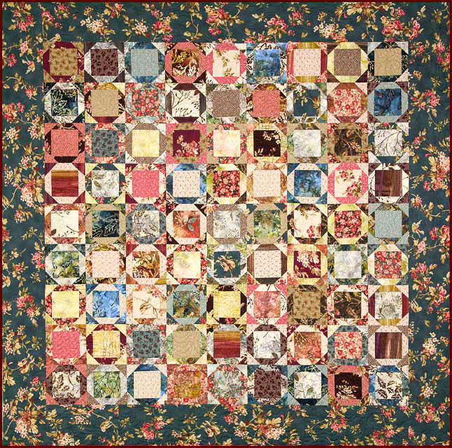 Hay Bale quilt designed by Edyta Sitar in rainbow fabrics.