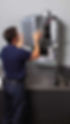 man fixing boiler