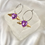 Thumbnail: Purple Heart Winged Hoop Earrings