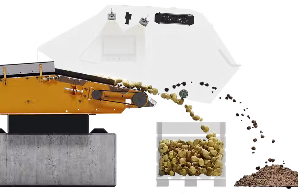 Optical sorter directing sorted materials into separate piles.