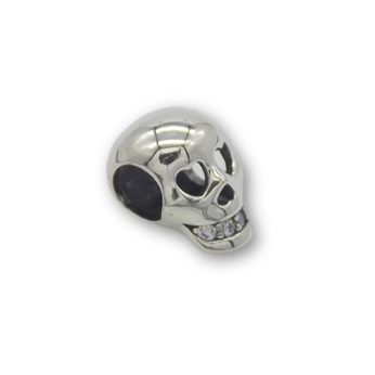Skull bead charm in sterling silver. Eyes in shape of hearts and jewels for teeth. Fits a charm bracelet.