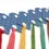 Thumbnail: Blue gingham floss drops with brightly colored embroidery thread attached through a large hole at the bottom.