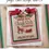 Thumbnail: Christmas counted cross stitch pattern cover. Design name is Jingle Bell Sleigh Ride Co.  Designed by Cherry Hill Stitchery.