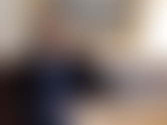 Woman standing in front of a microphone.