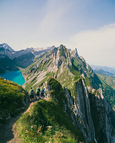 Hikers Swiss Alps Mountain Ridge Lake Summer.jpg