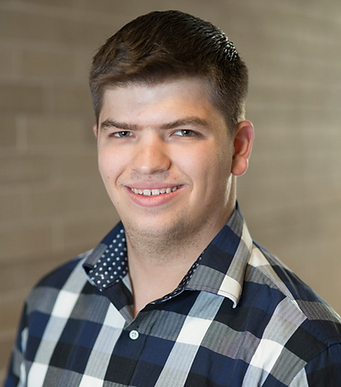 The headshot of Cooper Simon, theatrical lighting and projection designer.