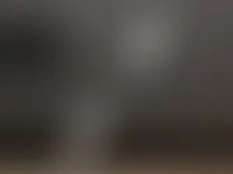 Black surface with model label "PC-XYZ123456789," highlighted by two white arrows. Vent and screw visible on the left.