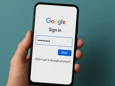 An Android phone showing the Google login screen with no verification prompt visible, representing a 2FA notification issue.