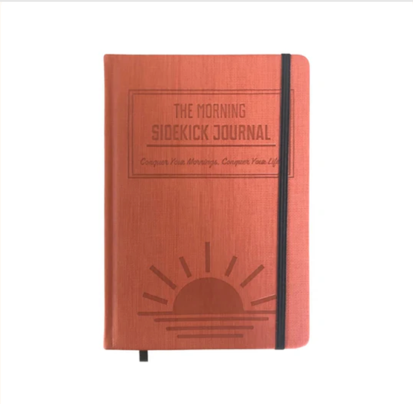 A red journal that helps you kickstart your mornings and is ADHD friendly.