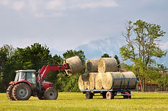 Tractor loading hay