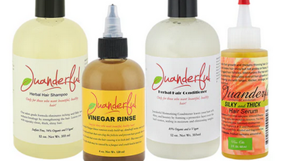 Four hair care bottles labeled "Juanderful" on a white background, featuring shampoo, vinegar rinse, conditioner, and serum with vibrant labels.