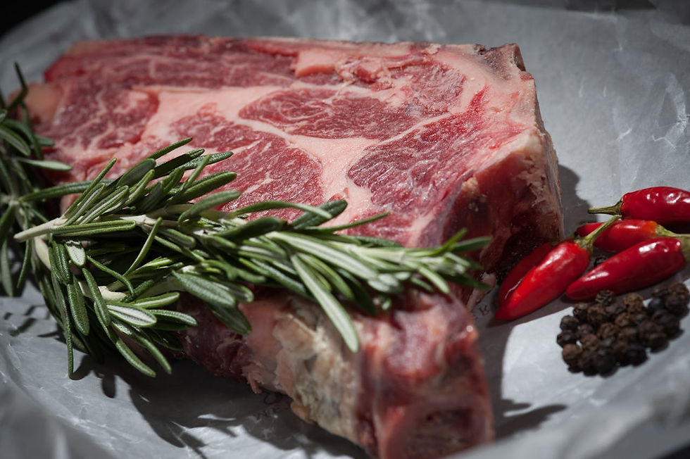 Freshly cut steak with rich marbling on a board