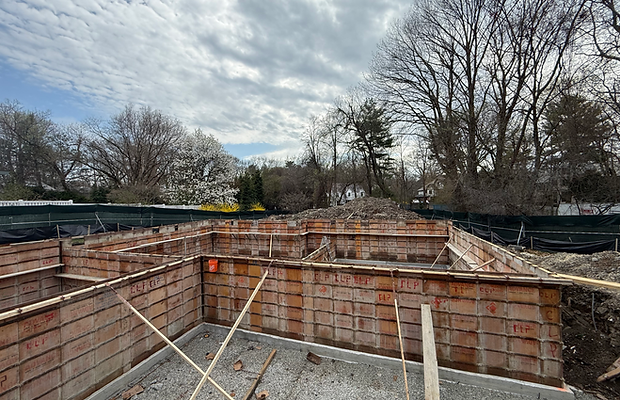 Foundation wall formwork defining the new Beverly Road home footprint in Brookline