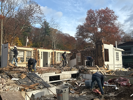 Demolition crew removing the existing Beverly Road house before excavation for the new home in Brookline