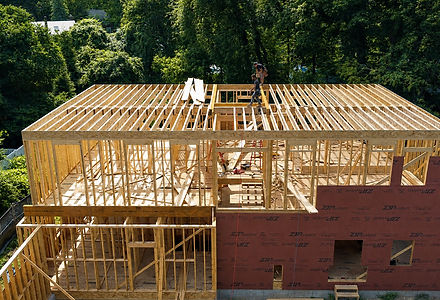 Exterior view of structural wood framing for the Beverly Road new home project in Brookline, MA.