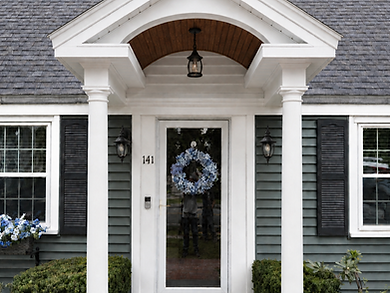 Completed Braintree front portico with white columns and an arched wood ceiling